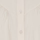 Melodie Blouse – kinakrave og knaplukning